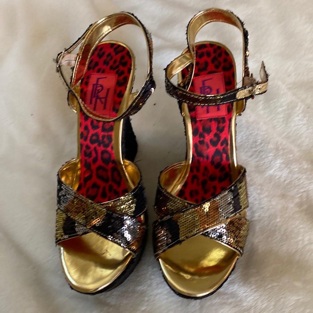 Beautiful platform shoes . Brand new FRH inside heels.black and gold ,